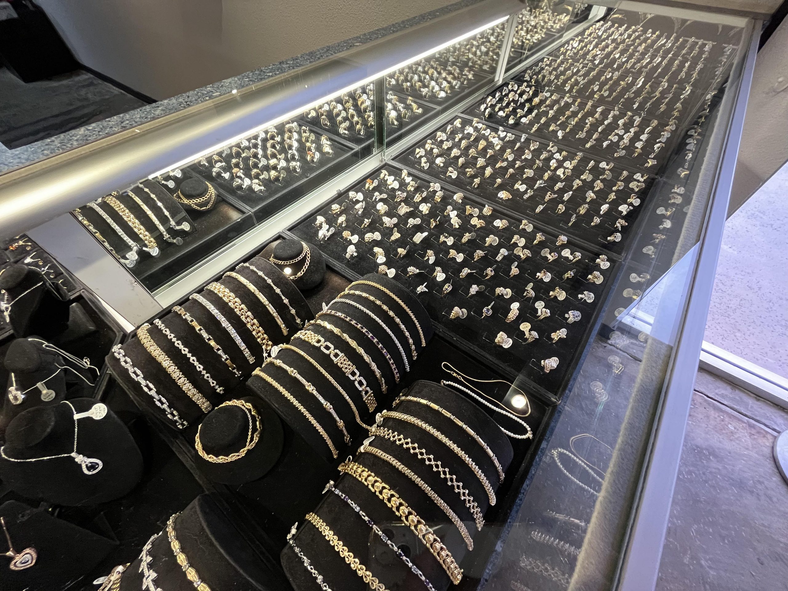 Image of jewelry section, bracelets and rings